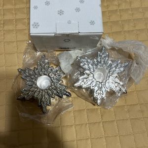 Silver plated snowflake candle holders. New, never used. 4 3/16” X 1 1/4”